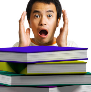 Man Looking At Books Shows Education